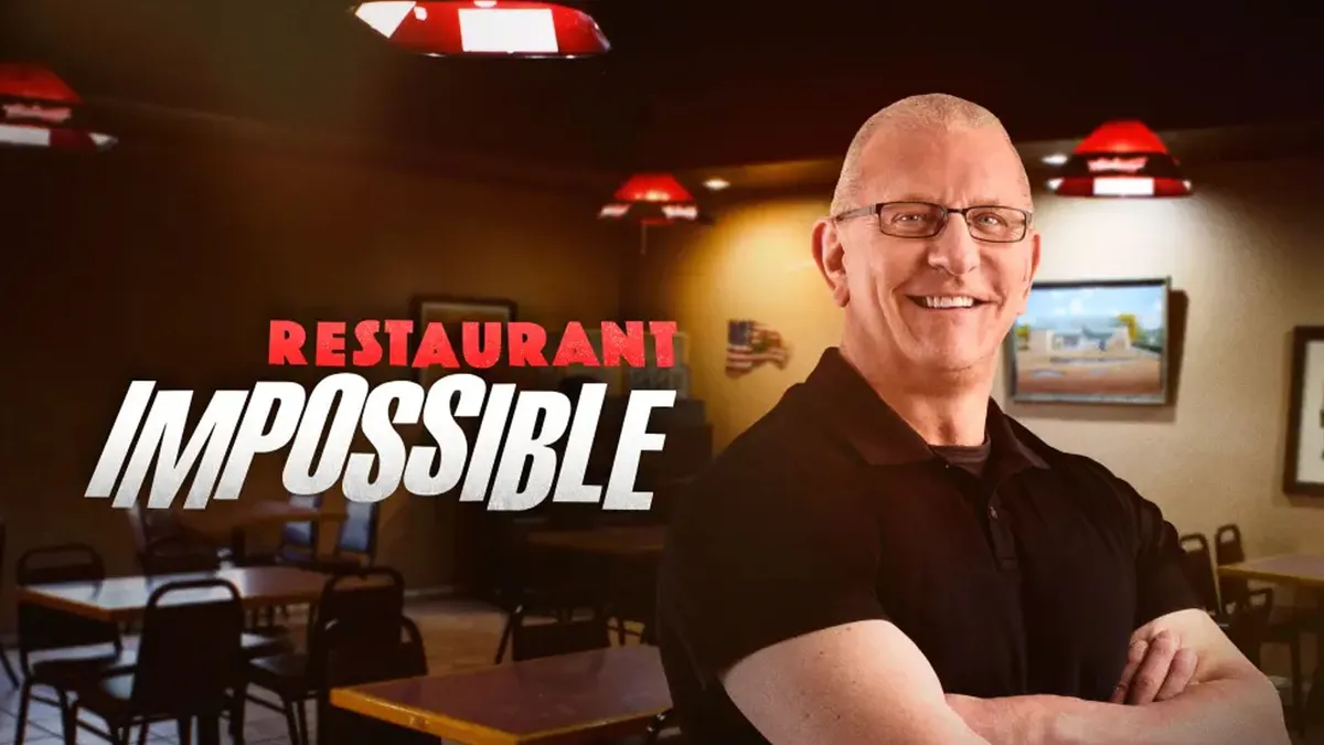 Chef Robert Irvine posing with a calm expression