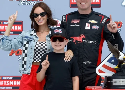 Photo of Kyle and Samantha Busch with their children.