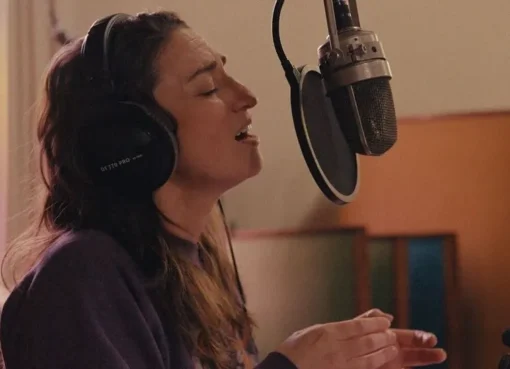 Singer-songwriter Sara Bareilles looking thoughtfully, perhaps with a soft, artistic lighting, as if contemplating deep emotions.