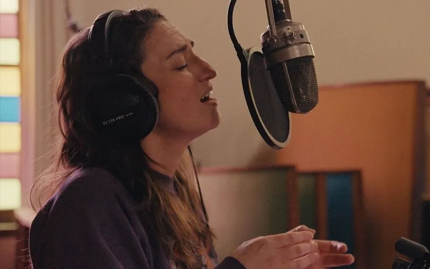 Singer-songwriter Sara Bareilles looking thoughtfully, perhaps with a soft, artistic lighting, as if contemplating deep emotions.