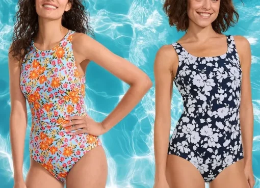 A woman smiling in a colorful swimsuit.