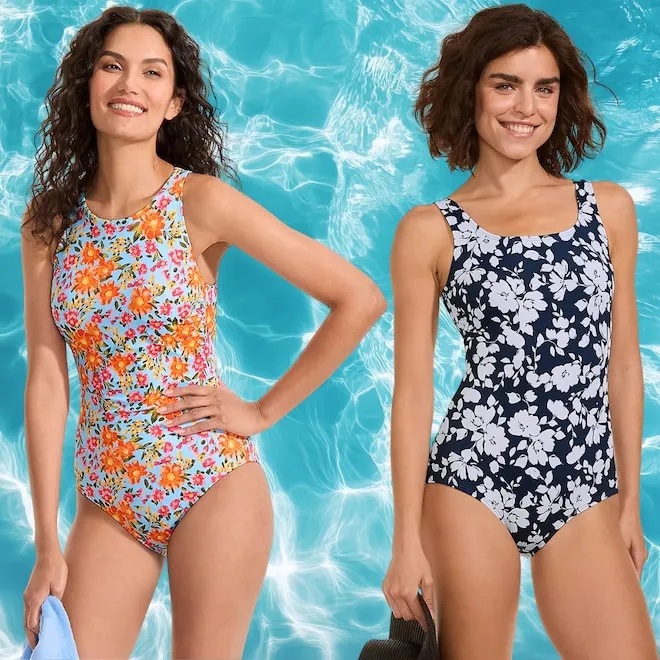 A woman smiling in a colorful swimsuit.