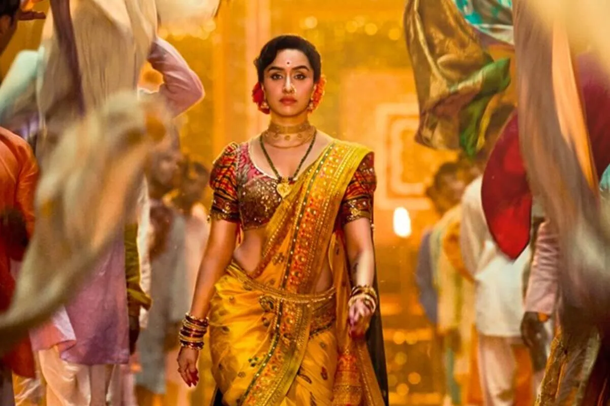Shraddha Kapoor in a traditional Lavani dancer costume, looking intense.