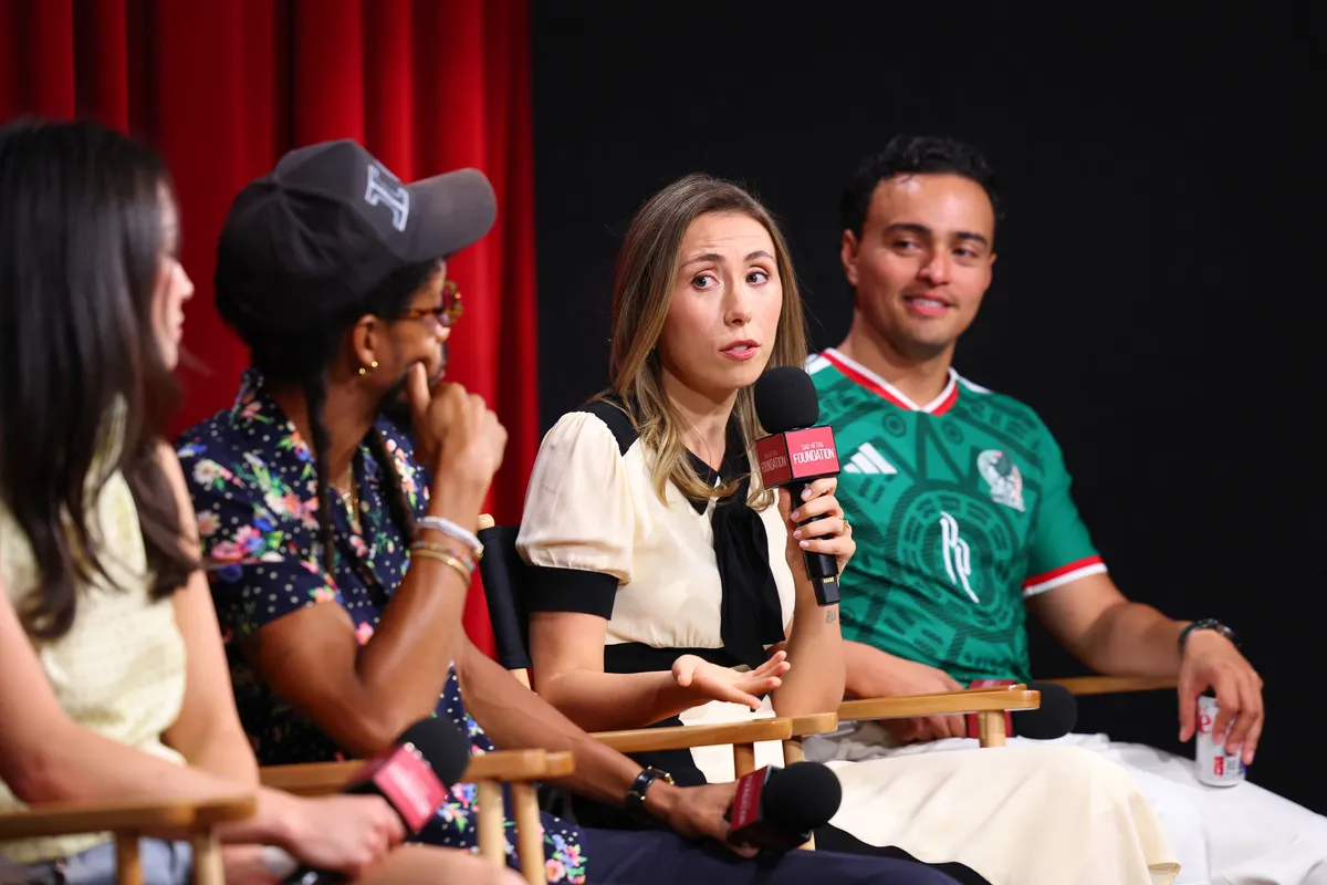 Young actors smiling at a press event, discussing their careers.