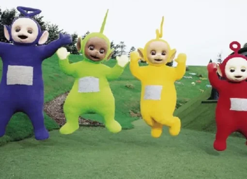 Children watching a colorful animated show on a screen, smiling and engaged.