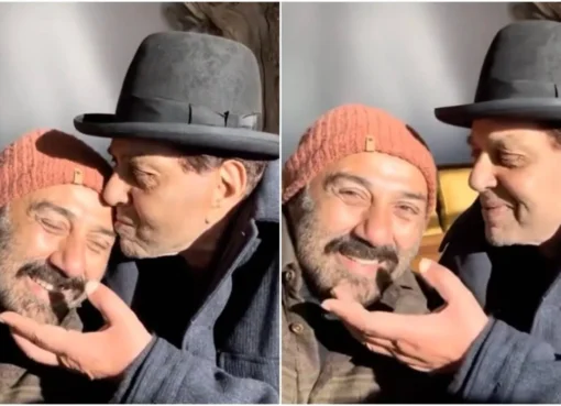 Sunny Deol and Dharmendra smiling together in a throwback style photo