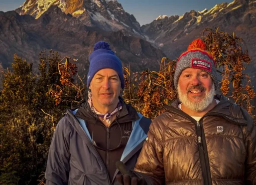Bob Odenkirk and David Cross smiling and looking mischievous, perhaps on a mountain trail.