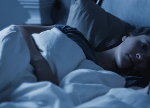 A still image from the short film 'Alone Time' showing a dimly lit room.