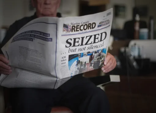 A still image from the documentary 'Seized' showing a newspaper office.
