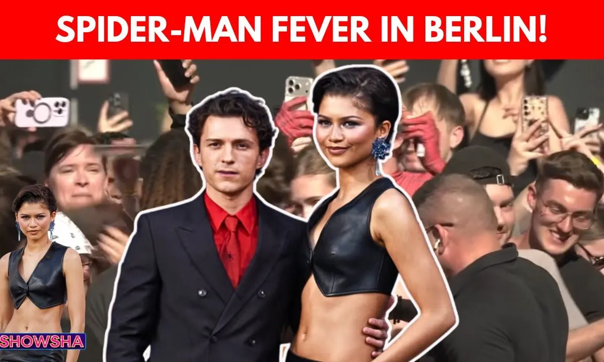 Tom Holland and Zendaya posing together at the Spider-Man Berlin fan event.