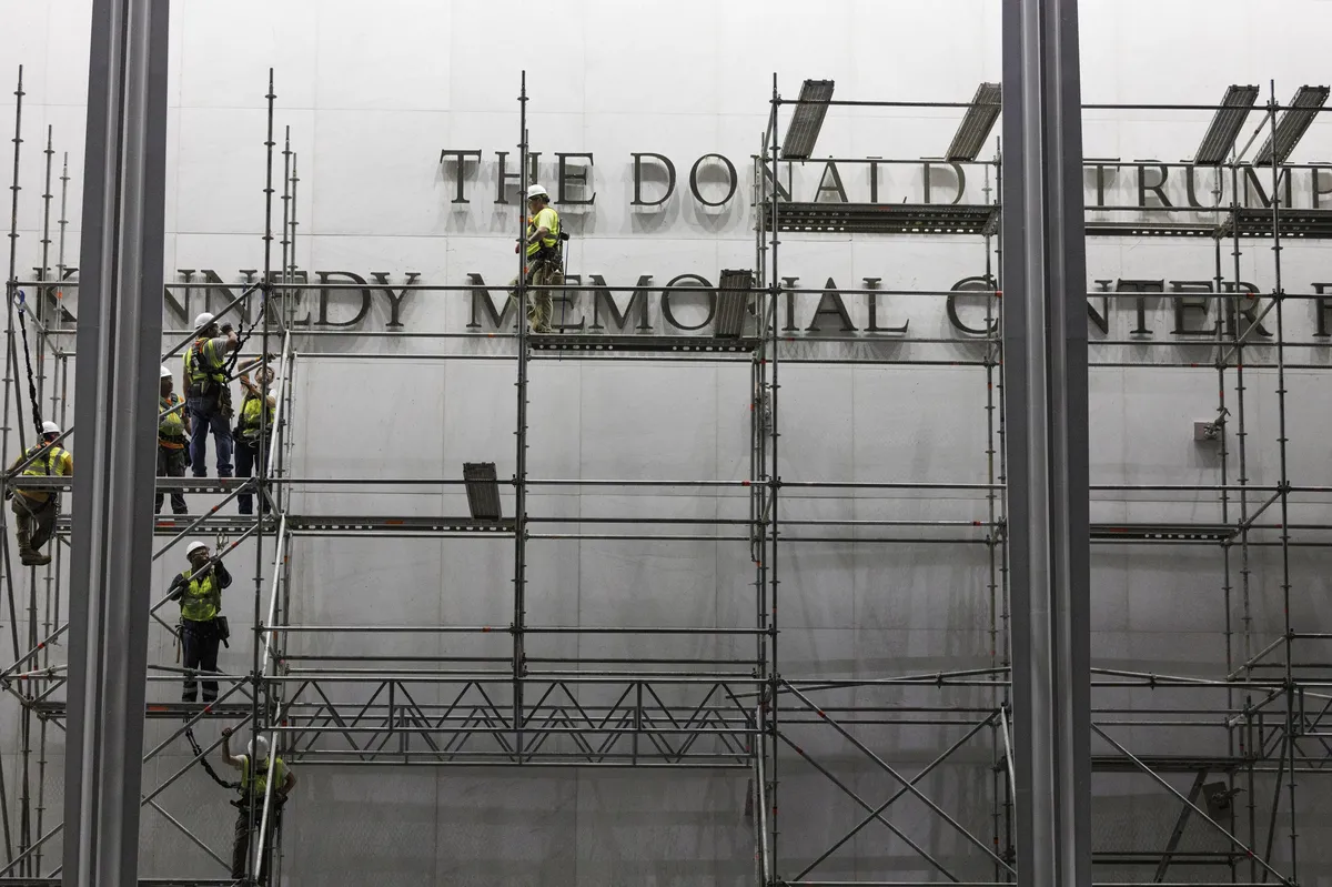 The white exterior of the Kennedy Center under a cloudy sky
