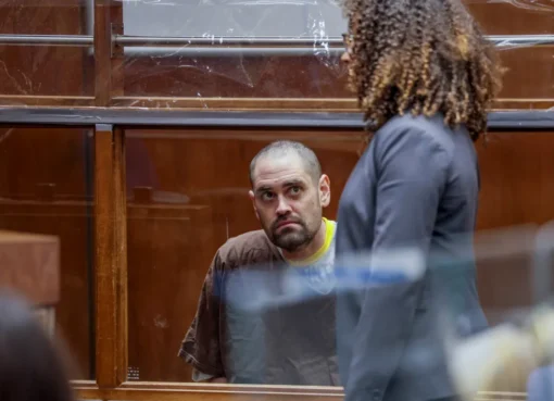 A young man looking stressed in a courtroom.