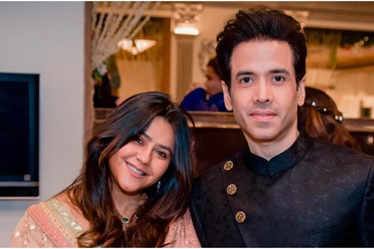 Tusshar Kapoor and Ekta Kapoor smiling.
