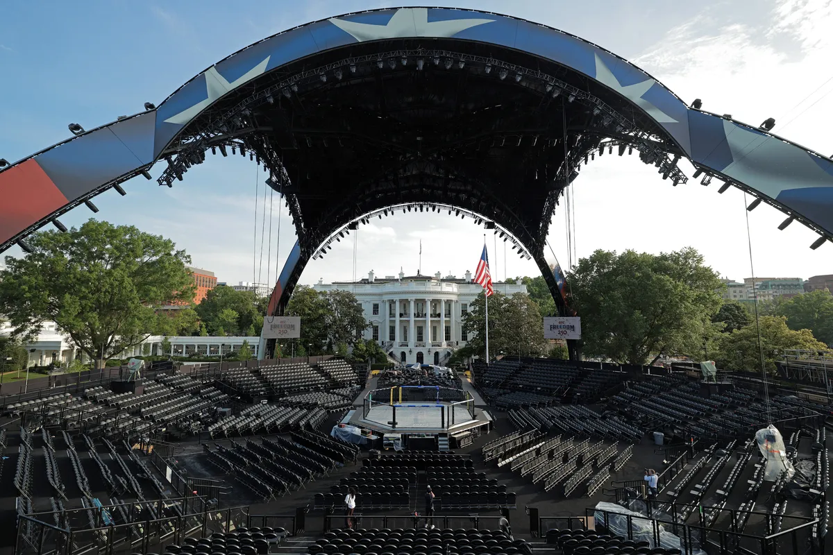 A large, temporary structure resembling a claw covers a fighting ring set up on the White House grounds.