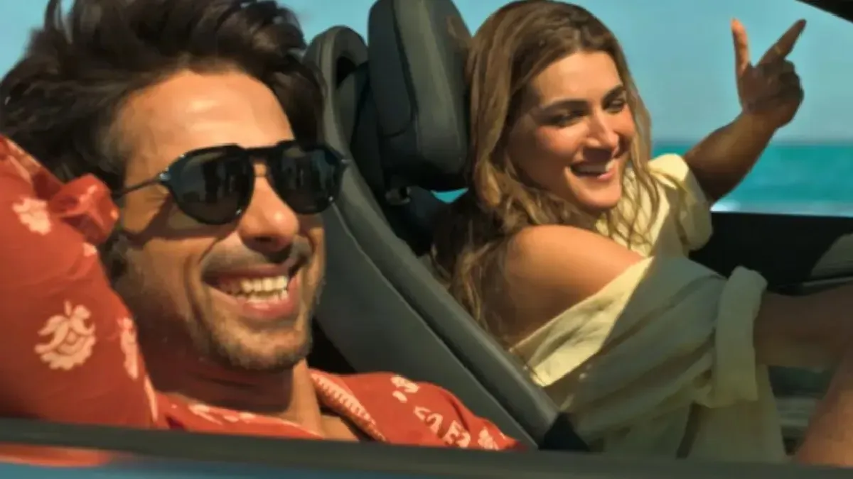 Shahid Kapoor and Kriti Sanon smiling and posing at a movie event.