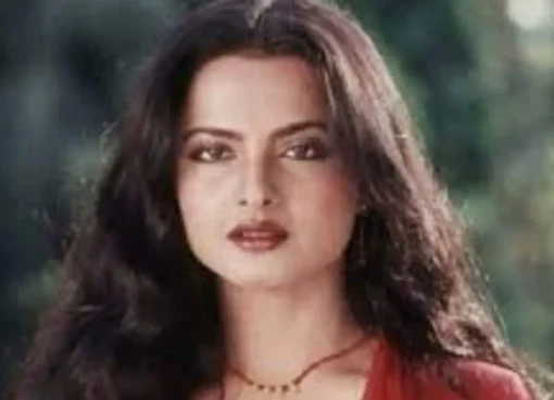 A vintage 1970s style shot of Rekha and Kamal Haasan looking dramatic.