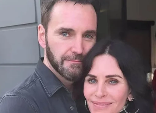 Courteney Cox and Johnny McDaid smiling together.