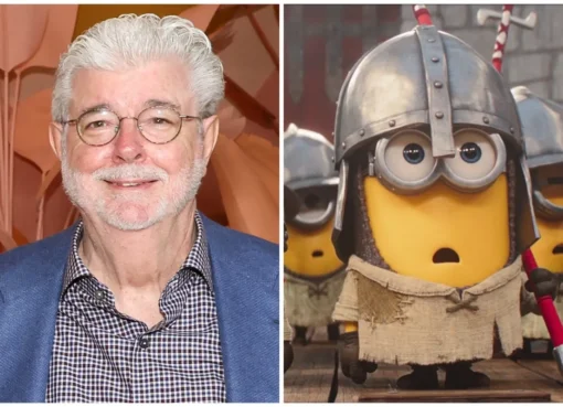 George Lucas smiling with a Minion character.