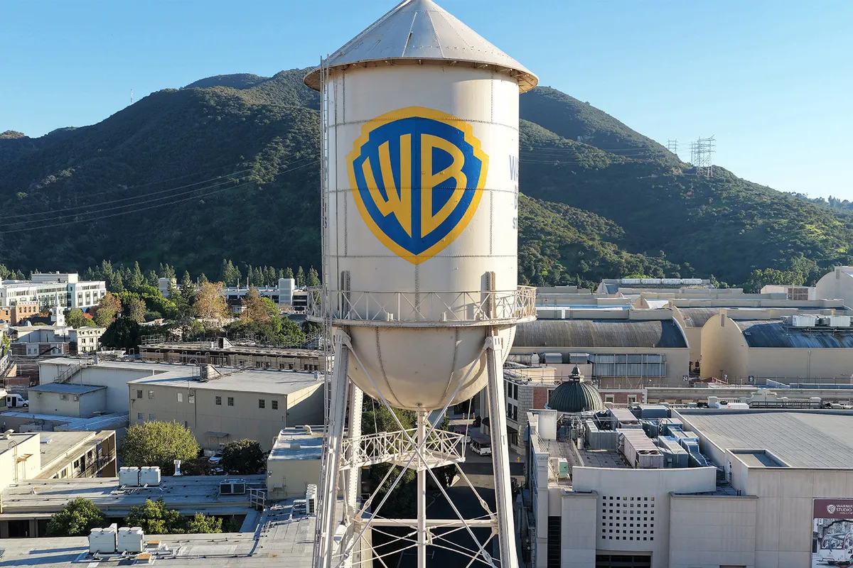 Photo of a senator's letter with movie studio logos in the background, signaling a merger delay.