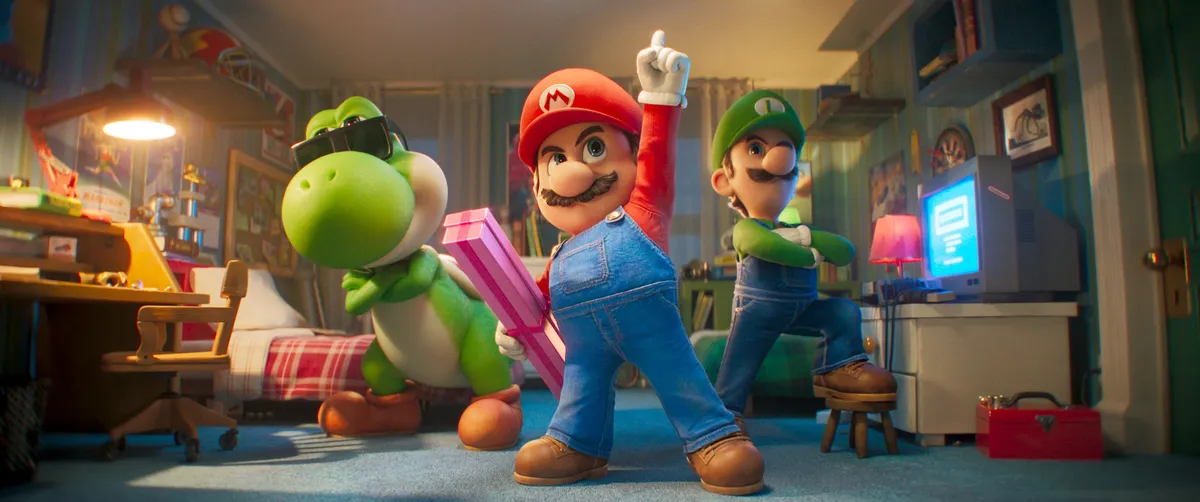 Mario flying through a colorful, star-filled space in a scene from the Super Mario Galaxy Movie.