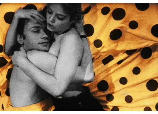 A film still from 'Deadly Sweet' featuring actors Jean-Louis Trintignant and Ewa Aulin in a dramatic scene.