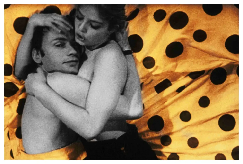 A film still from 'Deadly Sweet' featuring actors Jean-Louis Trintignant and Ewa Aulin in a dramatic scene.