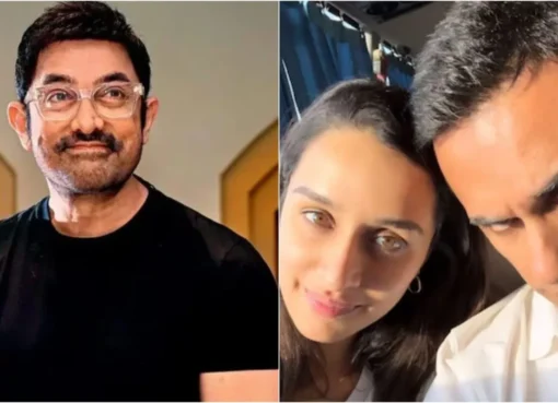 Aamir Khan smiling at a press conference.