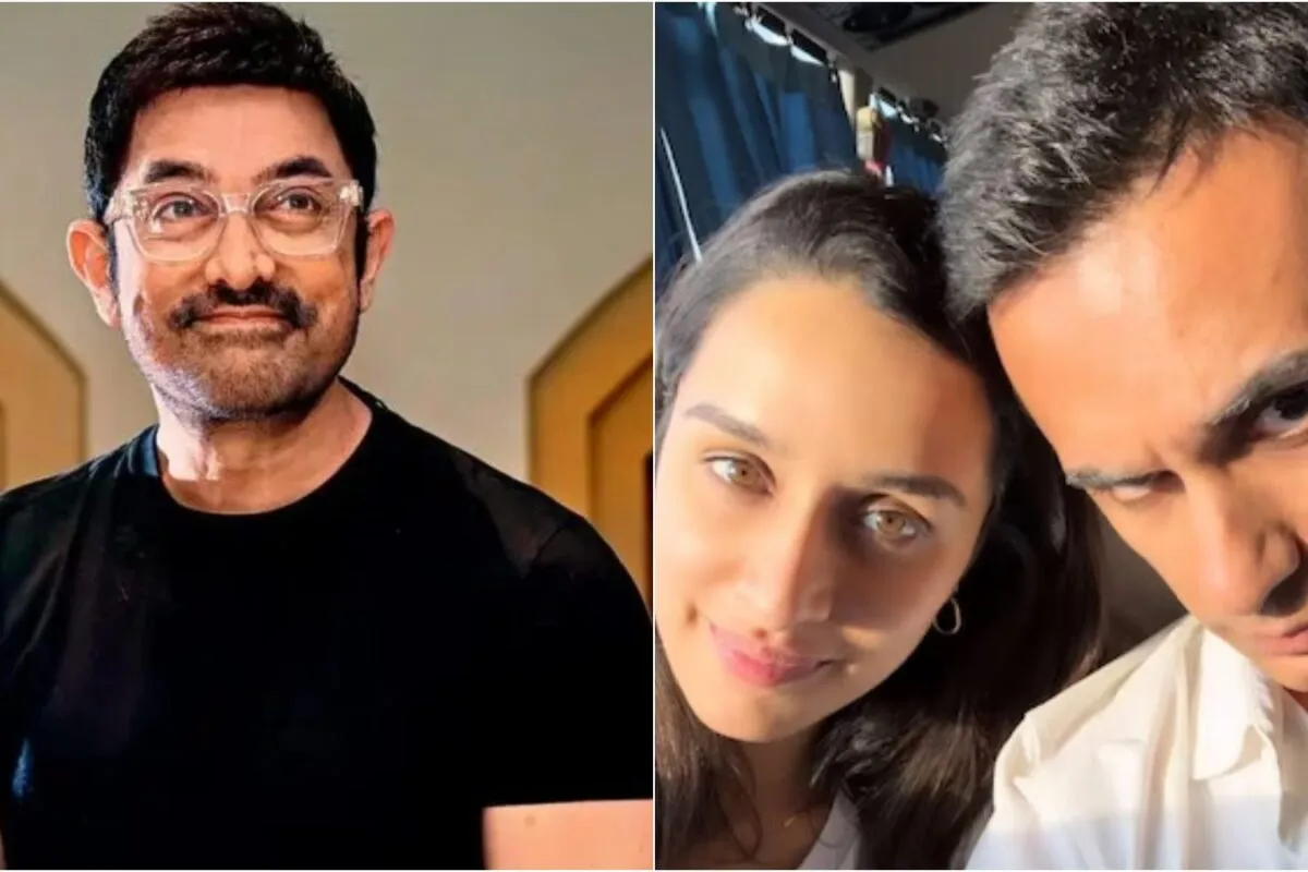 Aamir Khan smiling at a press conference.