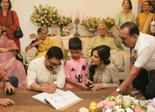Aamir Khan and Gauri Spratt smiling happily at their intimate home wedding ceremony.