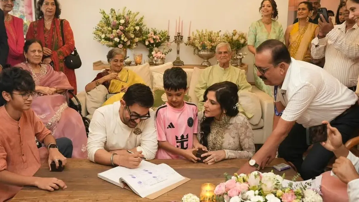Aamir Khan and Gauri Spratt smiling happily at their intimate home wedding ceremony.