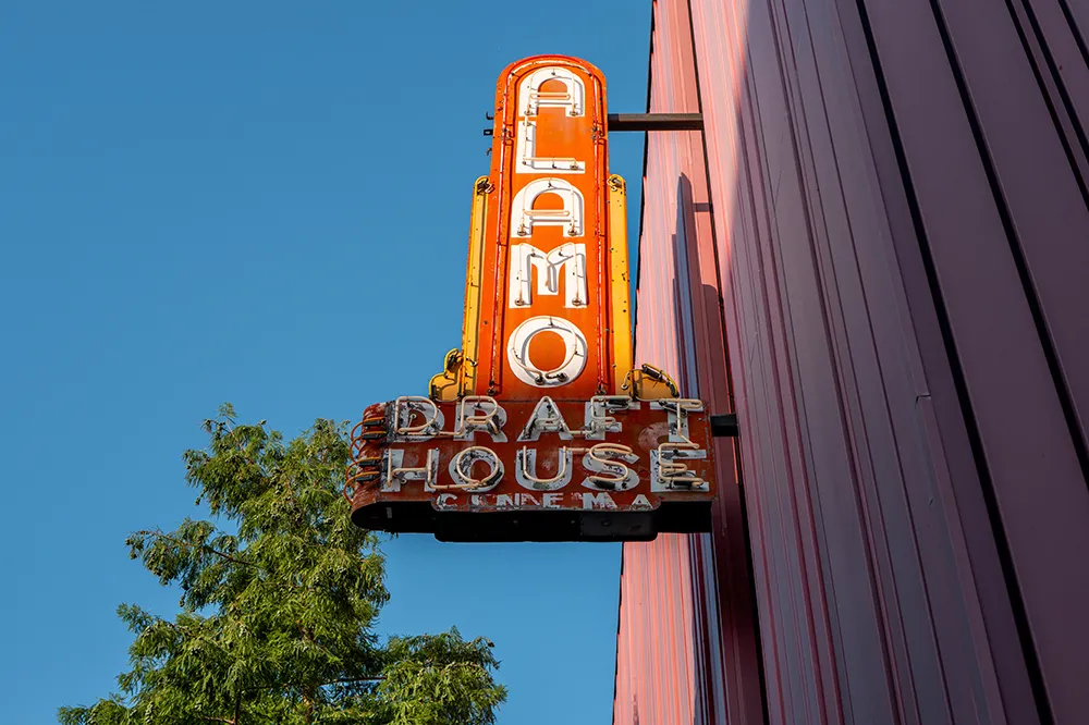An Alamo Drafthouse movie screen with the company logo.