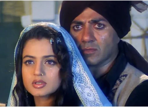Ameesha Patel and Sunny Deol looking serious on the Gadar movie set, perhaps discussing a scene.
