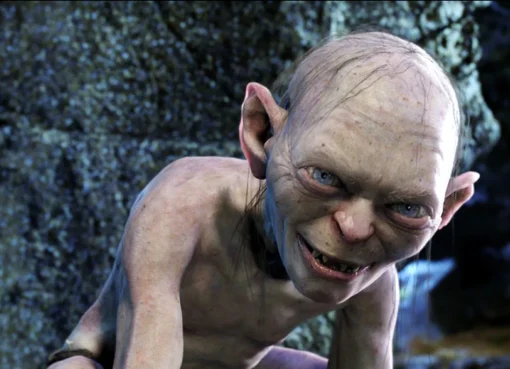 Andy Serkis wearing a gray motion capture suit on the set of The Hunt for Gollum.