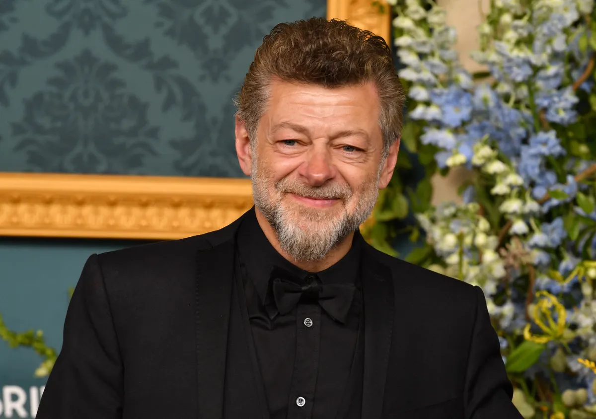Andy Serkis smiling and gesturing while talking about his new Lord of the Rings film.