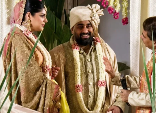 Anshula Kapoor and Rohan Thakkar smiling at their wedding.