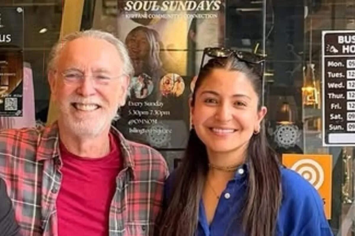 Anushka Sharma smiling at a restaurant in London with Krishna Das.