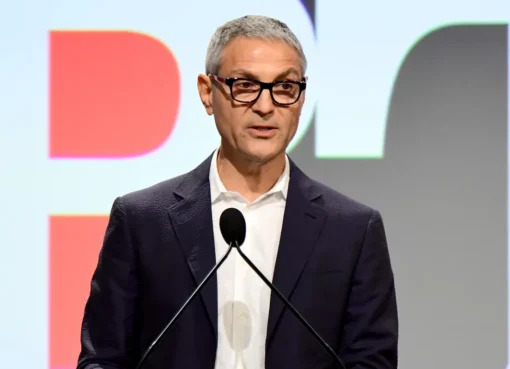 Ari Emanuel, a man in a suit, speaking intensely.