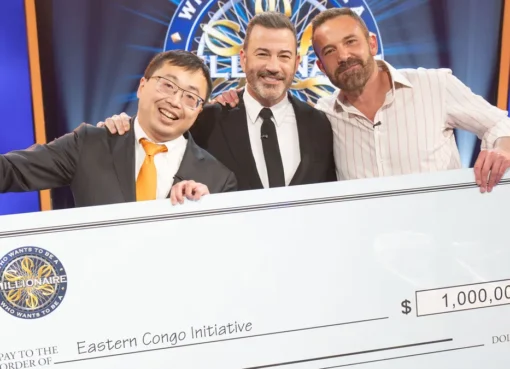 Ben Affleck and Jamie Ding celebrating their win on Who Wants to Be a Millionaire.