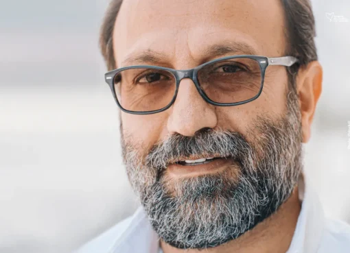 A portrait of filmmaker Asghar Farhadi.