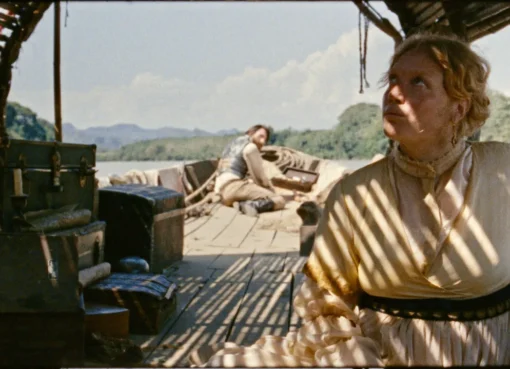 Film poster for 'In All My Journeys I Am Returning' showing a scenic view.