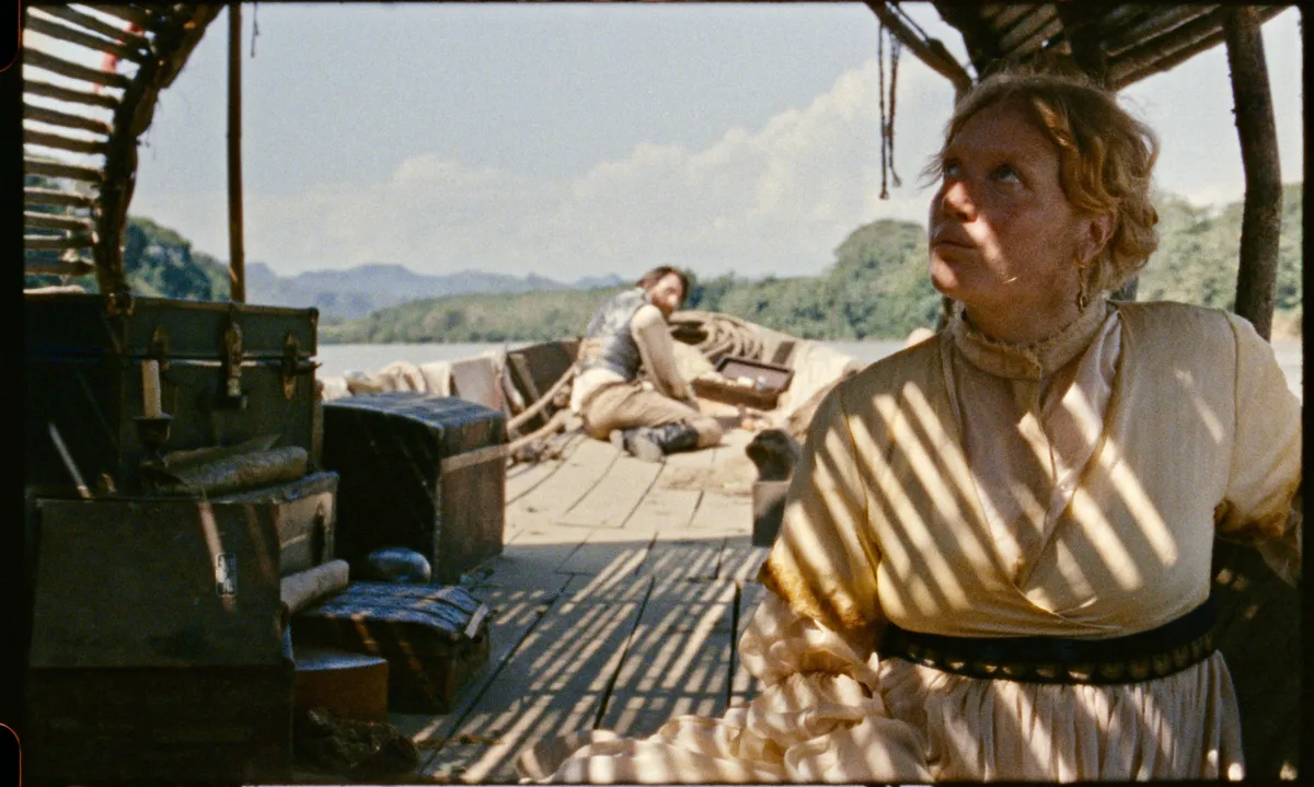 Film poster for 'In All My Journeys I Am Returning' showing a scenic view.