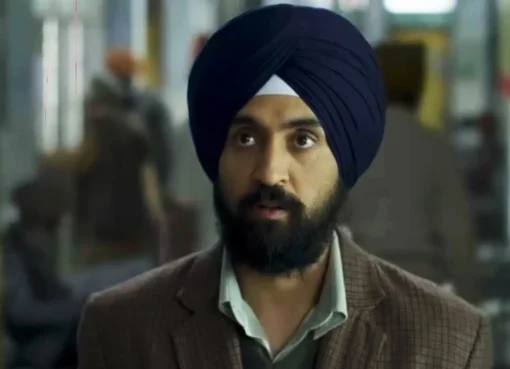 Diljit Dosanjh smiling slightly, looking thoughtful.