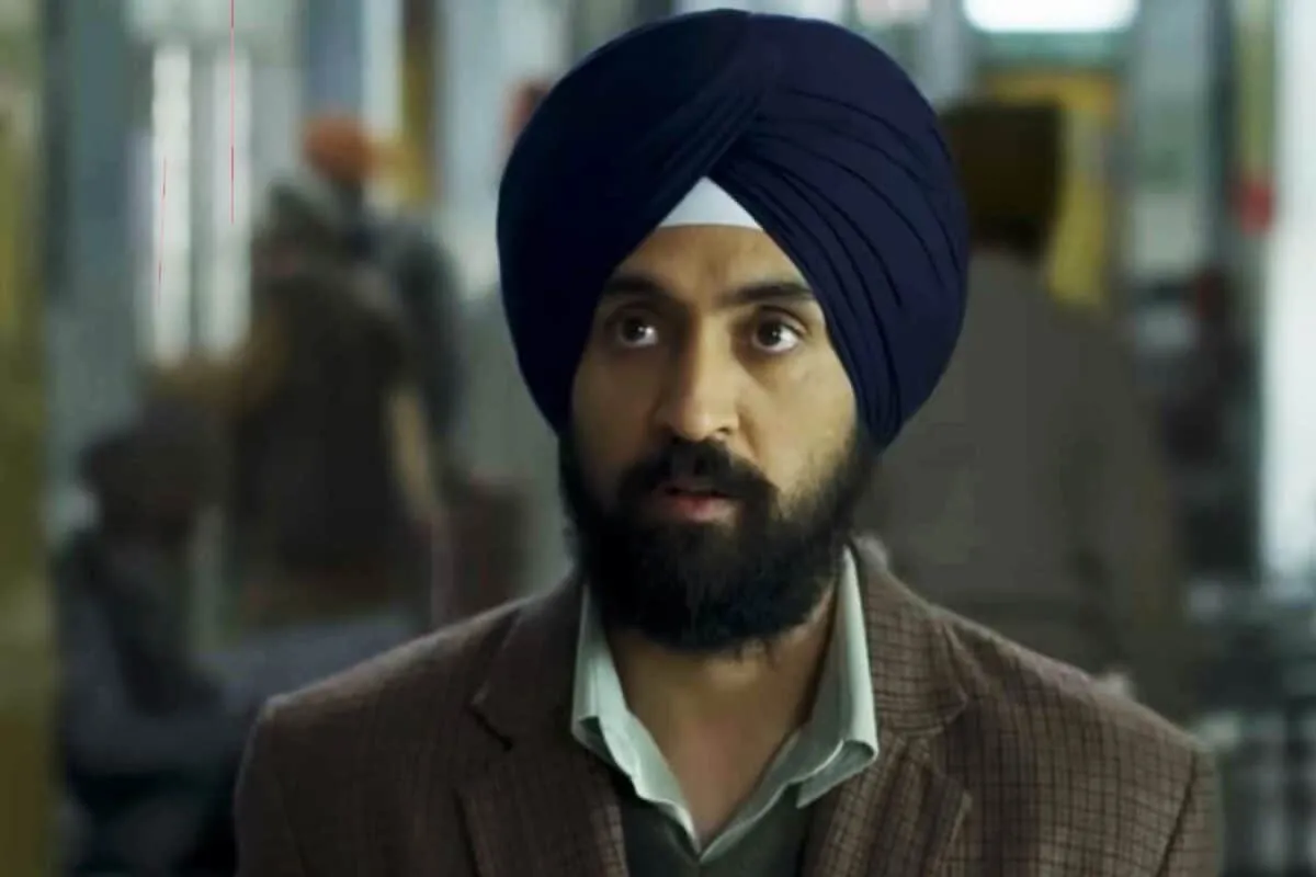 Diljit Dosanjh smiling slightly, looking thoughtful.