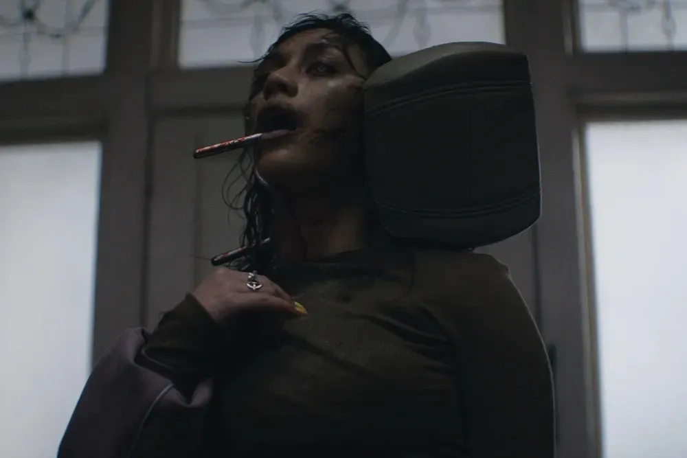 A scary scene from the movie Evil Dead Burn with blood and creepy vibes.
