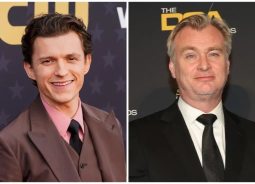 Tom Holland looking surprised, with director Christopher Nolan on a film set.