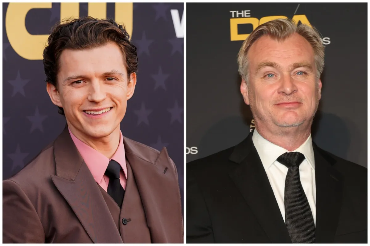 Tom Holland looking surprised, with director Christopher Nolan on a film set.
