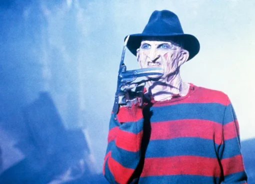 A close-up of Freddy Krueger's iconic razor glove, ready to strike.