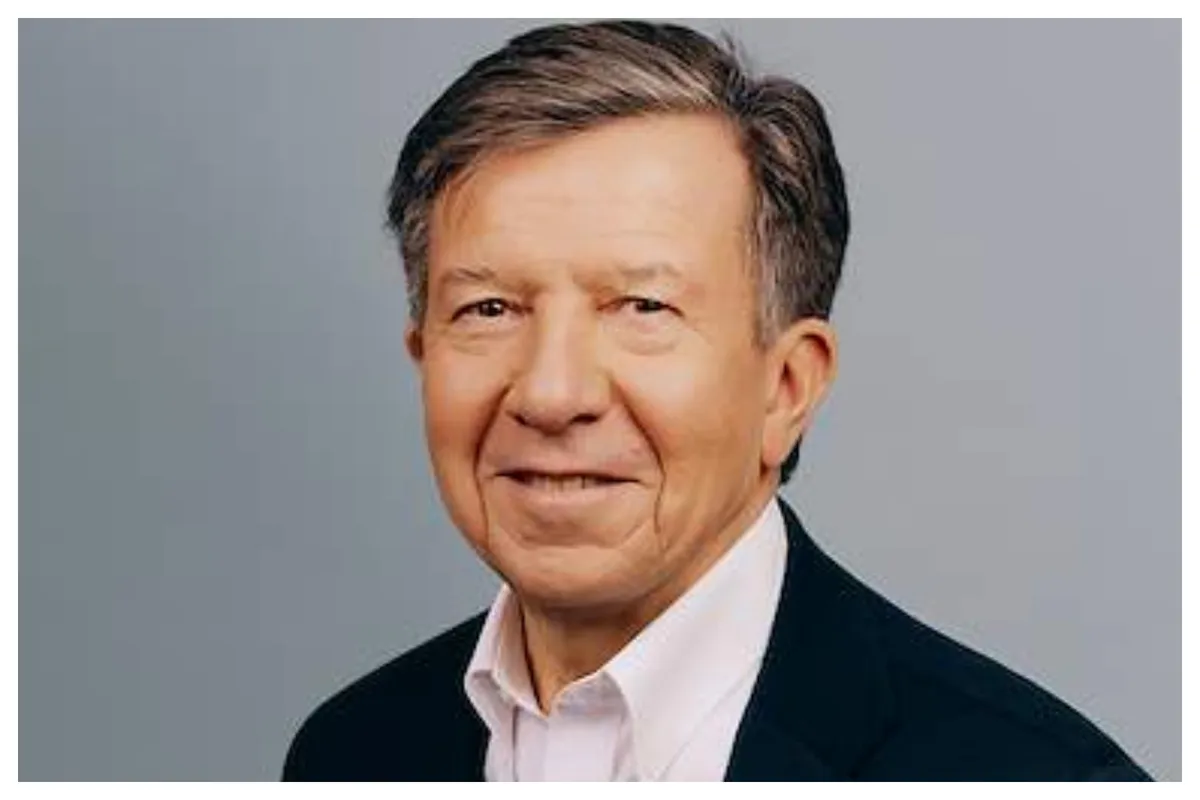 Gilles Pélisson, a man with short hair and glasses, smiles slightly, wearing a suit jacket.