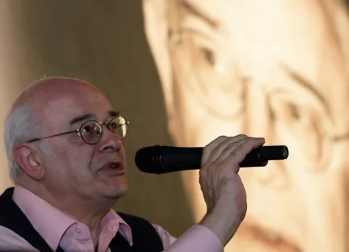 Close-up portrait of film critic Tony Rayns smiling.
