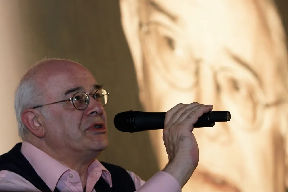Close-up portrait of film critic Tony Rayns smiling.